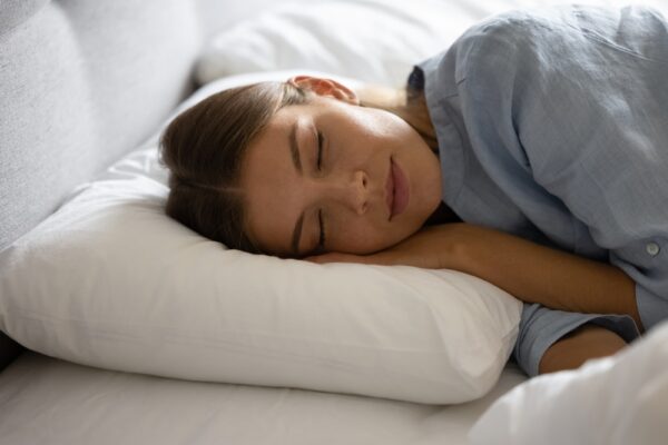 A girl sleeping peacefully in bed