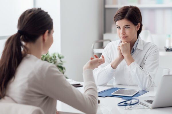 Woman visiting her doctor regarding sleep apnea solutions