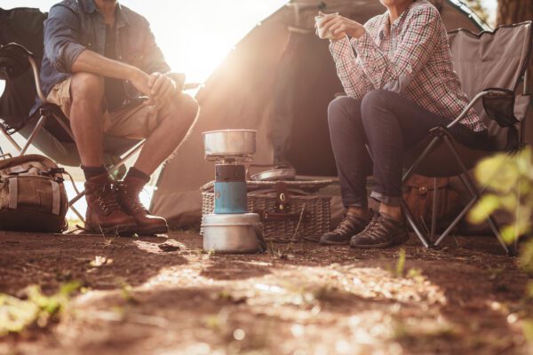 cropped image of people camping