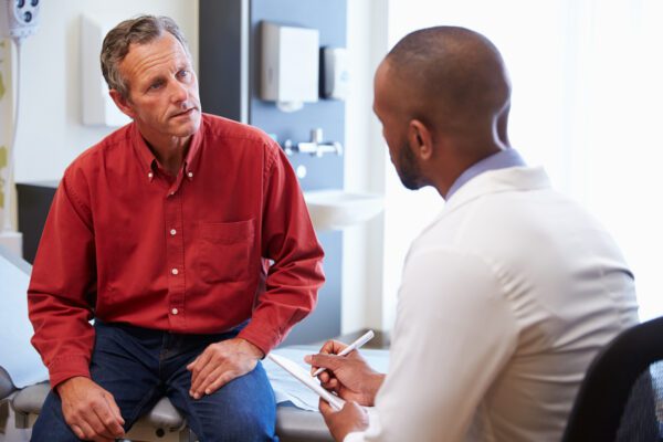 male patient talks to doctor