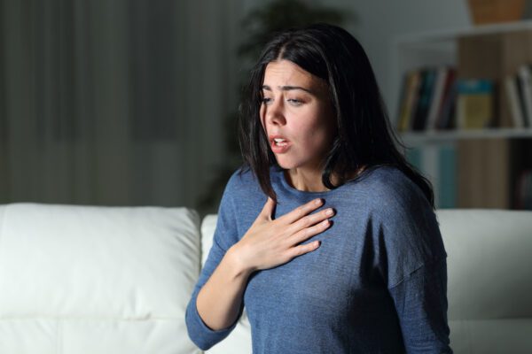 woman waking up gasping for air