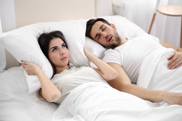 person disturbed by partner's snoring